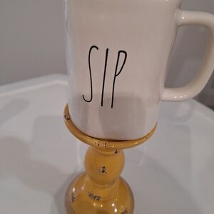 Rae Dunn White Mug with Black "SIP" Lettering and Yellow Pedestal
